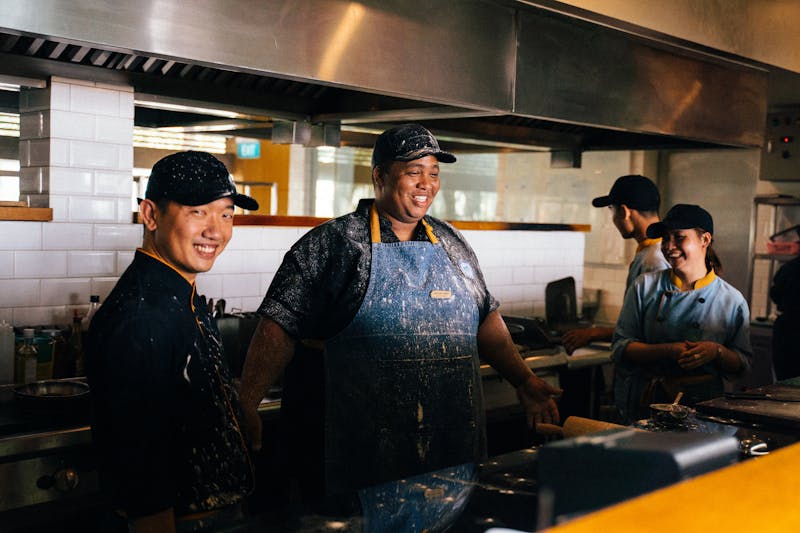 Friendly restaurant staff member smiling